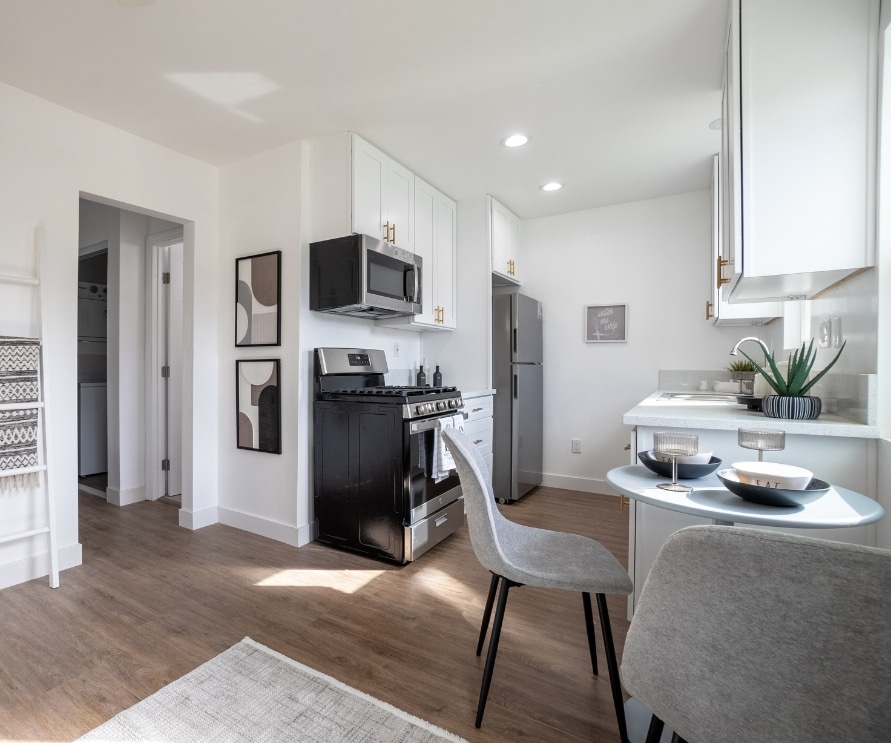 Modern kitchen and dining area in a garage conversion ADU with stylish decor