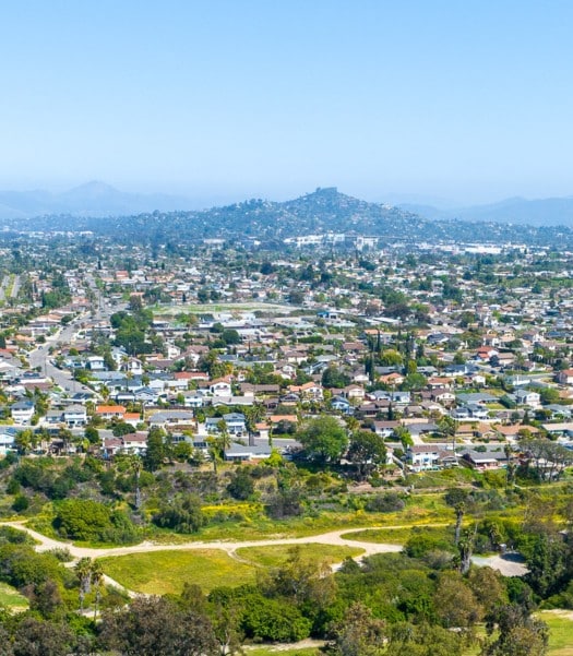 Aerial view of La Mesa neighborhood, highlighting the potential for converting a garage to an apartment, showcasing residential homes and spacious properties ideal for such conversions.