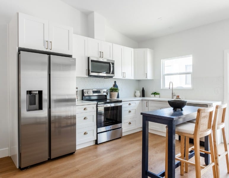 Modern kitchen by trusted family-owned ADU builders, featuring sleek appliances and a clean, open design.