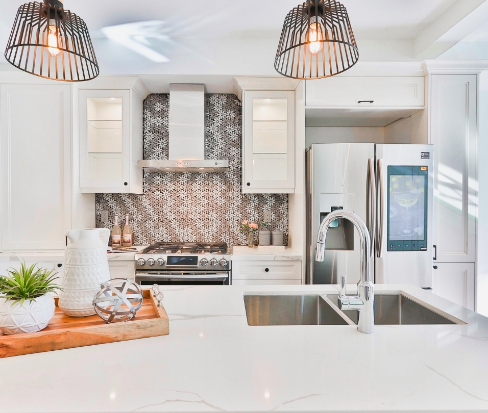 a kitchen with white cabinets and a sink